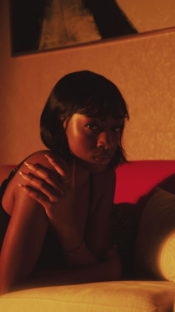 Woman with a bob haircut in warm amber light